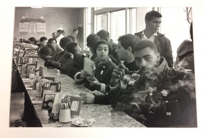 Photo by Danny Lyon: A Toddle House in Atlanta has the distinction of being occupied during a sit-in by some of the most effective organizers in America when the SNCC staff and supporters take a break from a conference to demonstrate, 1963